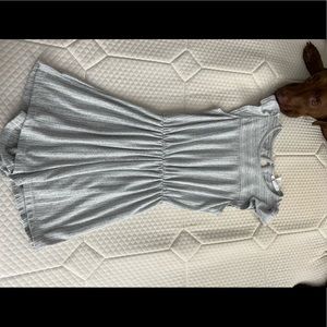 Grey romper with ruffled sleeves